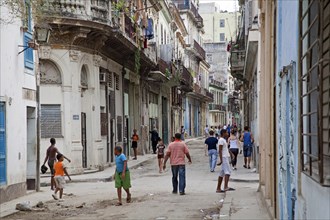 Youngsters in dilapidated street in Old Havana