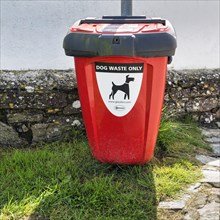 Red bin with inscription