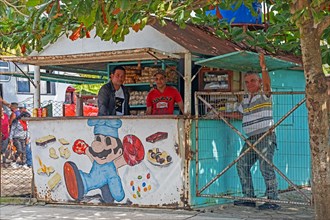 Cuban street vendors in food stand in the town Jatibonico