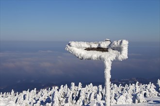 Signpost in the snow in winter at Brocken