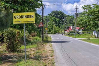 Sign and road entering the village Groningen in the Saramacca District