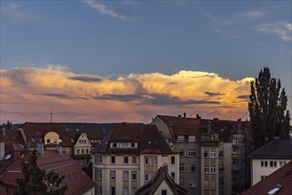 Thunderclouds over the houses of the city