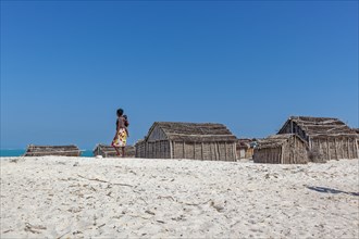 Village with reed huts on the beach