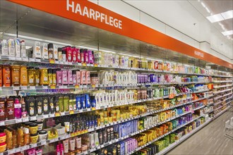 Shelves with hair care products in a department store