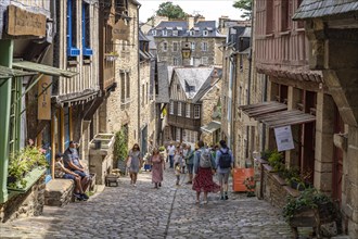 Alley with cobblestones in the historic old town of Dinan