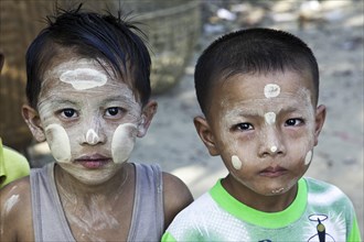 Two boys with thanaka on their faces
