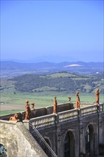View over terracotta figures to wooded hills