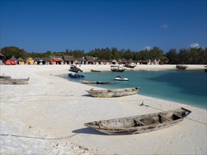 Beach and bay with boats and huts