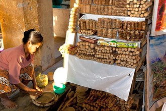 Woman selling Tanaka wood