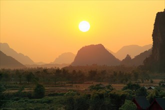Sunset over mountain landscape near Vang Vieng