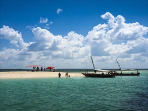Boats and sandbank in the turquoise sea