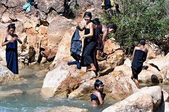 Women washing at the river Nam Pilu