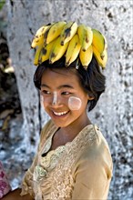 Girl with bananas on her head