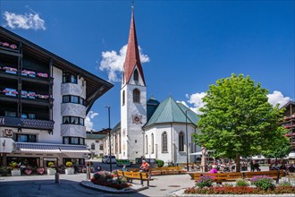 Village square with the pilgrimage church of St. Oswald