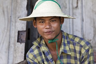 Young man with rice hat