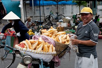 Man selling baguettes