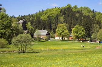 Village in mountain landscape with rocks