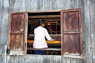Weaver in weaving mill