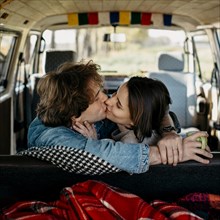 Man woman kissing van