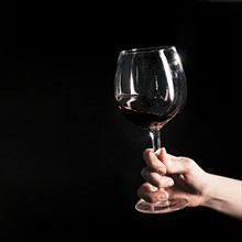 Crop hand with wineglass