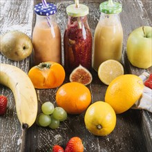 Healthy fruits around smoothie