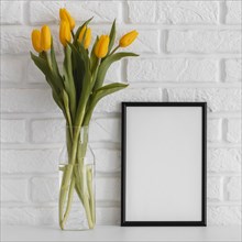 Bouquet tulips transparent vase with empty frame