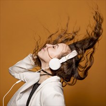 Side view female with headphones