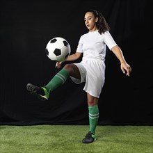 Full shot female playing football
