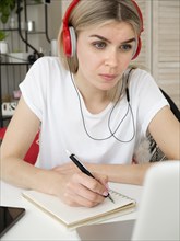 Smart young student wearing red headphones