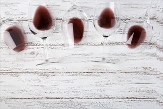 Top view glasses laying table with red wine