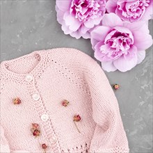 Crocheted pink jacket with flowers