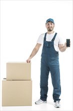 Friendly deliveryman showing smartphone