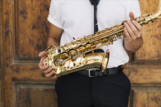 Musician holding sax