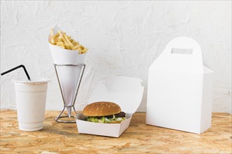 Burger french fries disposal cup food parcel mock up wooden table top