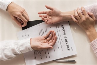 Hands with divorce decree close up
