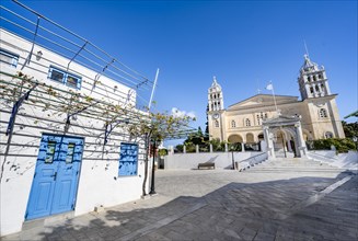 White Cycladic house and church Agia Triada