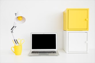 Spacious workplace white yellow colors with metal boxes