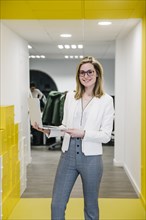 Trendy businesswoman with laptop office