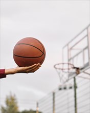 Black american woman playing basketball close up