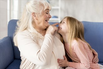 Playful grandma with girl