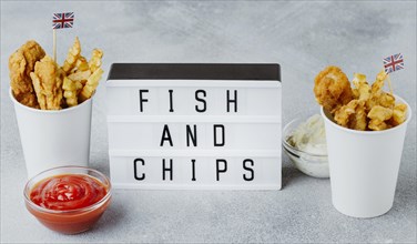 High angle fish chips paper cups with great britain flags light box