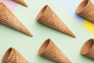 Empty ice cream waffle cones colourful background