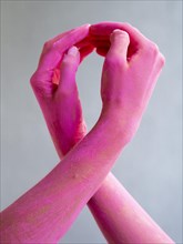 Close up painted arms expressing cancer awareness