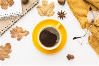 Top view coffee cup with glasses autumn leaves