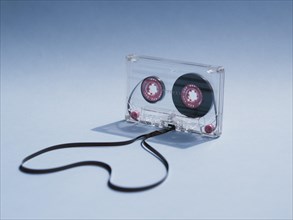 Close up shot clear cassette tape gradient background