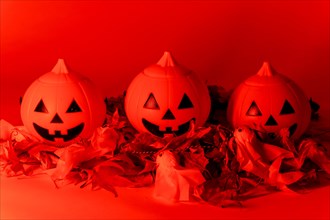 Halloween pumpkins on a red background