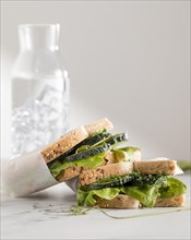 Front view sandwiches with greens cucumber