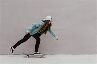 Skater girl riding her skateboard