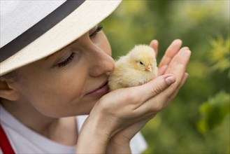 Woman holding chick farm