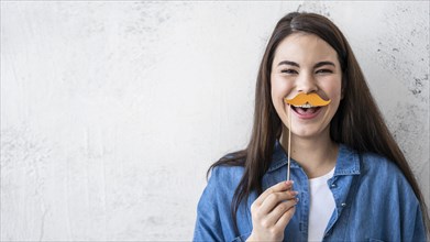 Portrait happy woman laughing with mustache